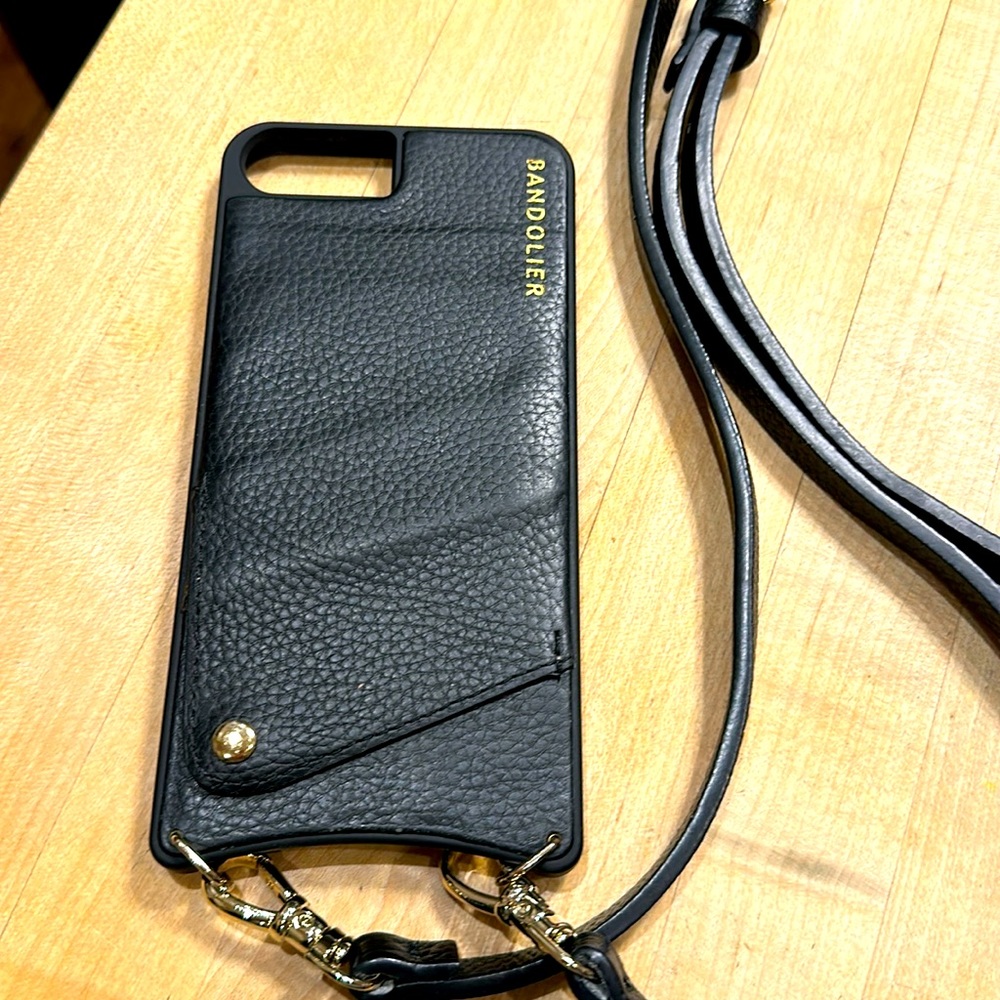 Bandolier phone carrying case with adjustable / removable strap.